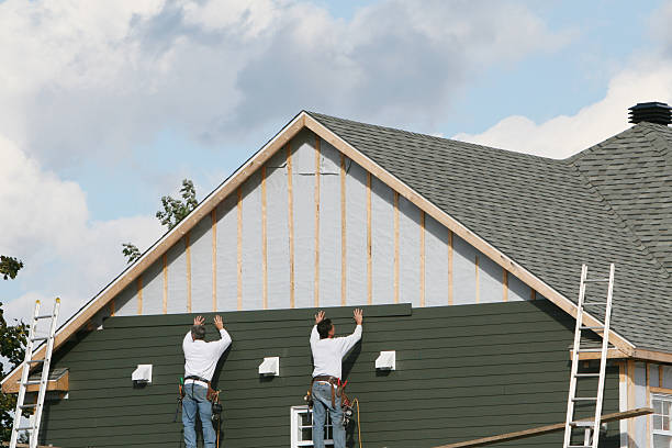Professional Storm Damage Siding Repair technician working in Dry Run, PA